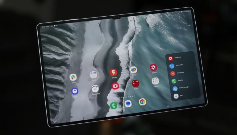Samsung Galaxy Tab S11 Ultra placed on a clean desk setup with keyboard case and S Pen, large AMOLED screen glowing, modern workspace aesthetic